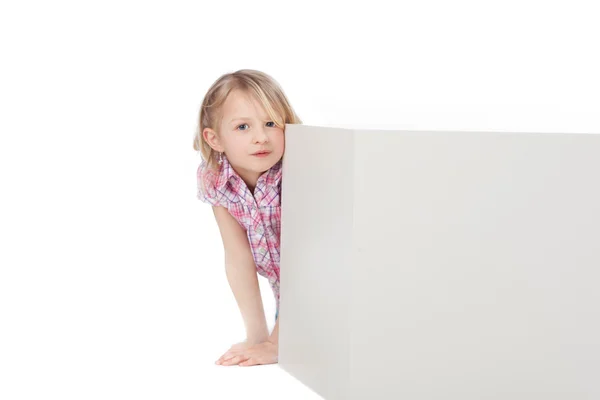 Girl Hiding Behind Block Against White Background — Stock Photo, Image