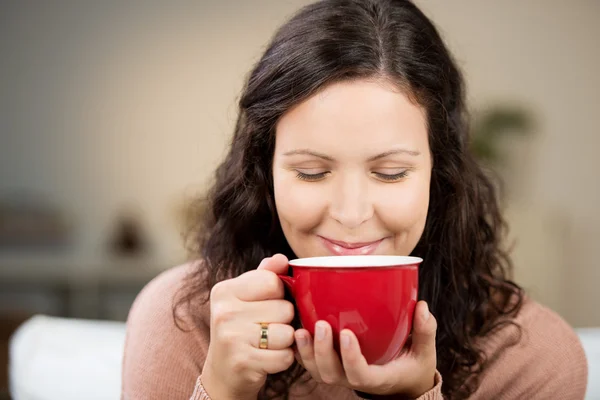 Woman With Eyes Closed Drinking Coffee At Home Royalty Free Stock Photos