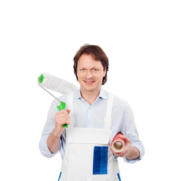 Friendly painter with a roller and wallpaper — Stock Photo, Image