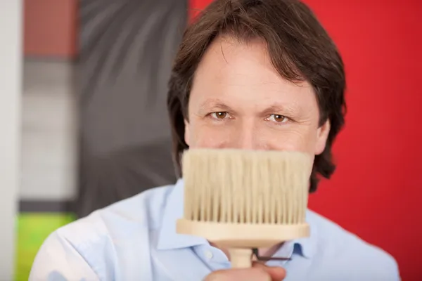 Interior designer with a paint brush — Stock Photo, Image