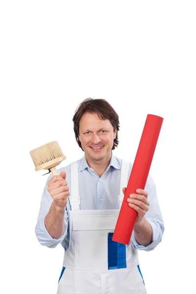 Artisan with wallpaper and a brush — Stock Photo, Image