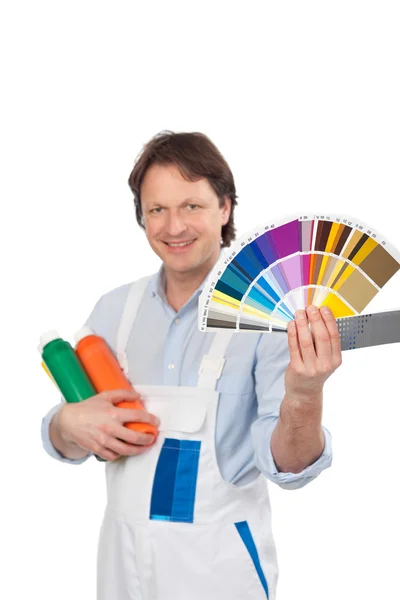 Painter with paints and sample cards — Stock Photo, Image