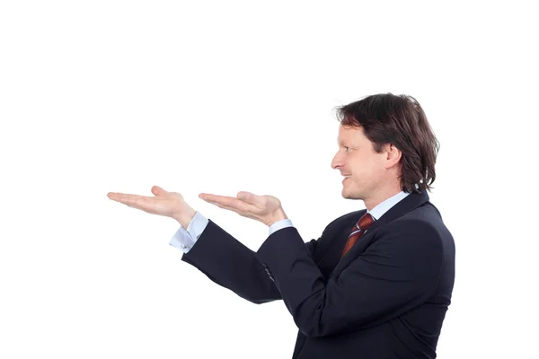 Businessman holding something on his hands — Stock Photo, Image