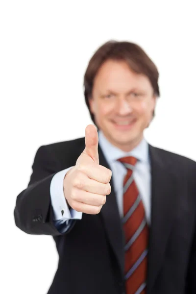 Businessman giving a thumbs up gesture — Stock Photo, Image