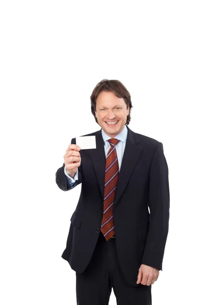 Confident businessman with a visiting card — Stock Photo, Image