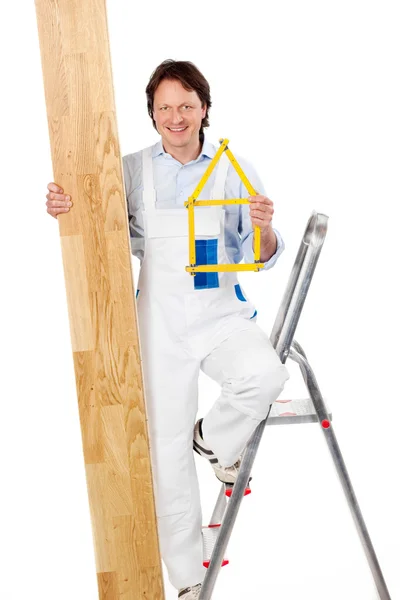 Handyman with parquet flooring — Stock Photo, Image