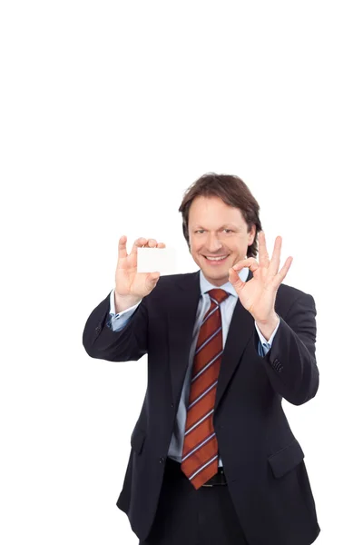 Man with a business card giving a perfect sign — Stock Photo, Image