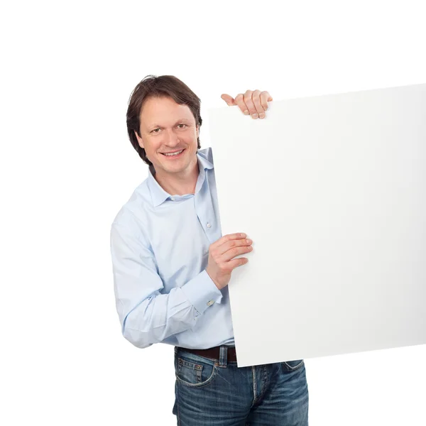 Jistý muž ukazuje prázdnou bílou tabuli — Stock fotografie