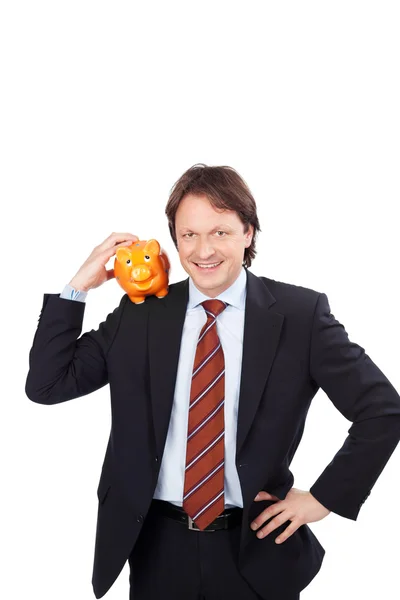 Geschäftsmann und Sparschwein — Stockfoto