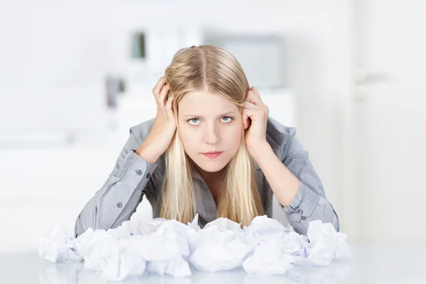 Businesswoman With Heap Of Wastepaper On Desk — Stock Photo, Image
