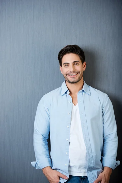 Man Standing Against Blue Wall — Stock Photo, Image