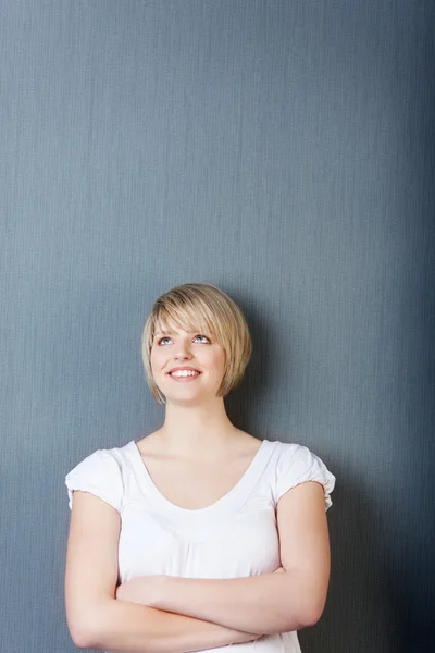 Portrait of a pretty blond woman on grey — Stock Photo, Image