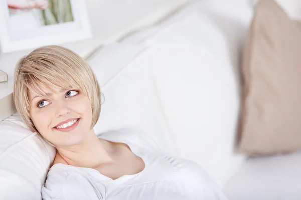 Blond woman relaxing and daydreaming — Stock Photo, Image