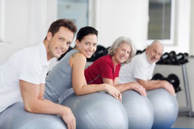 Group exercising in a gym clipart