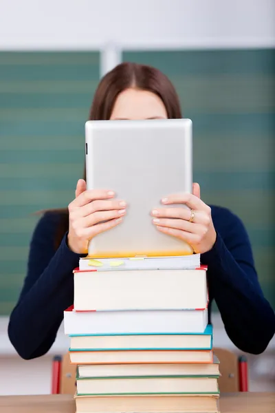 Woman with books and ipad touch — Stock Photo, Image