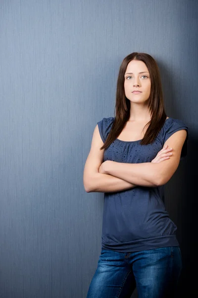 Beautiful young female with arms folded — Stock Photo, Image