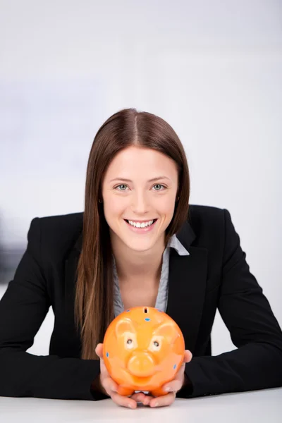 Businesswoman with piggybank — Stock Photo, Image