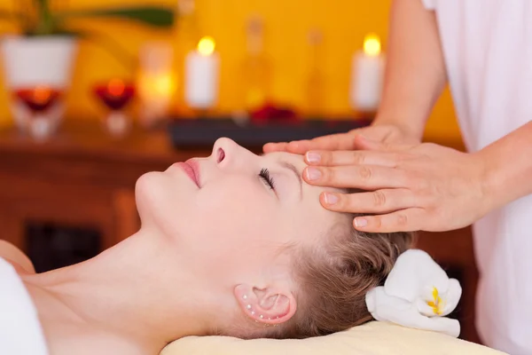 Closeup of young woman receiving head massage — Stock Photo, Image