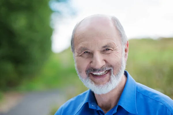 Happy Caucasian retired bearded man, outdoors — Stock Photo, Image