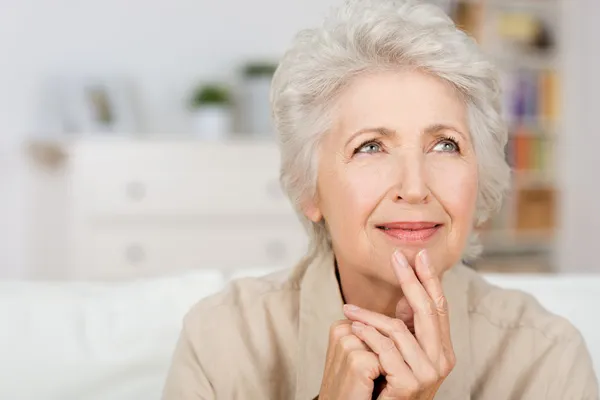 Thoughtful senior lady — Stock Photo, Image