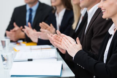 Businesspeople in a meeting applauding clipart