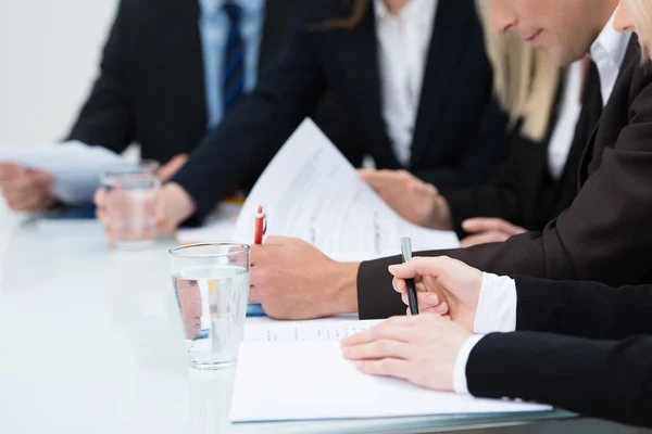 People taking notes in a meeting — Stock Photo, Image