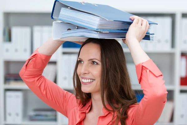 Playful young business clerk with folders — Stock Photo, Image