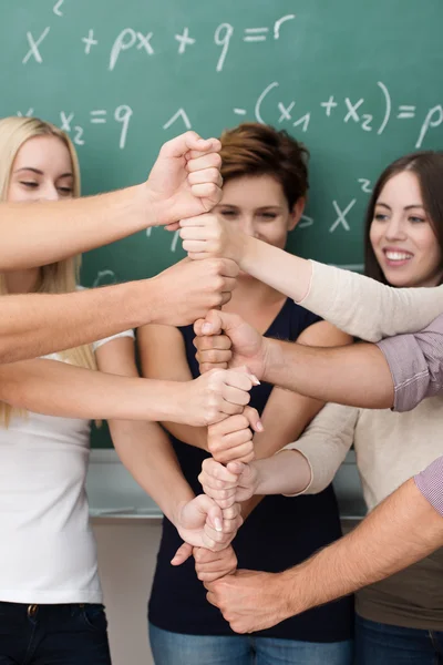 People stacking their fists into a tower — Stock Photo, Image