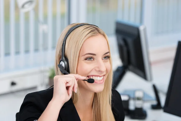 Friendly call centre operator or receptionist — Stock Photo, Image