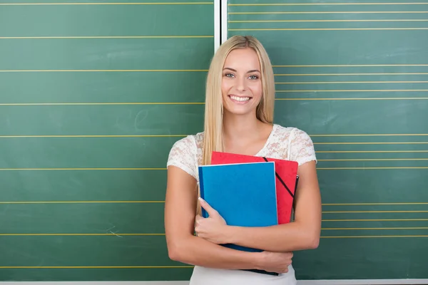 Feliz muito jovem estudante feminino — Fotografia de Stock