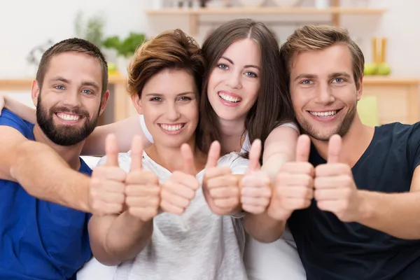 Happy smiling friends giving a thumbs up — Stock Photo, Image