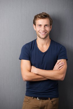 Confident casual unshaven young man