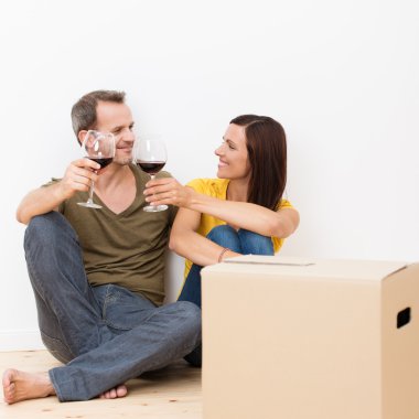 Young couple celebrating their move clipart