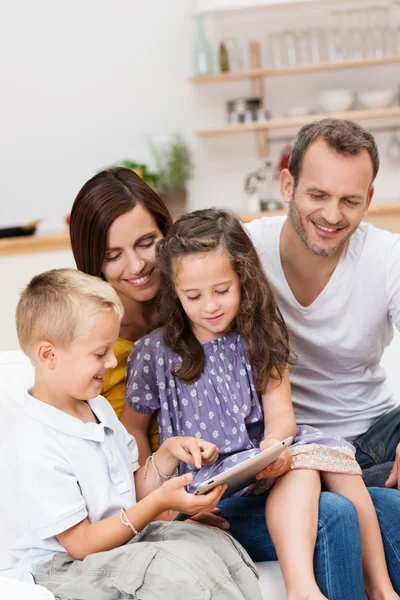 Little boy showing the family data on a tablet — Stock Photo, Image