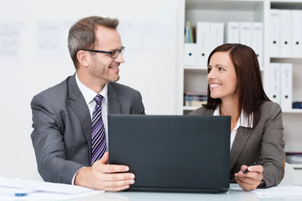 Smiling business colleagues in the office — Stock Photo, Image