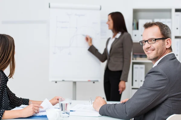Smiling businessman in a meeting — Stock Photo, Image