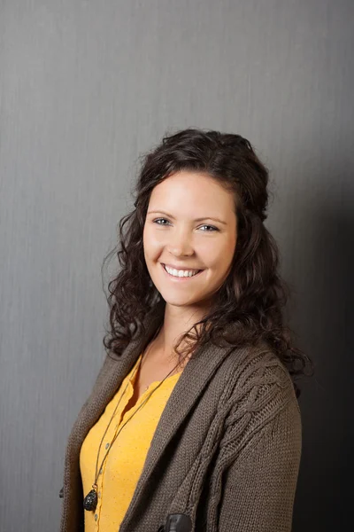 Beautiful woman with curly brunette hair — Stock Photo, Image