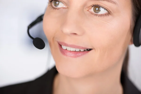 Attractive woman wearing a headset — Stock Photo, Image