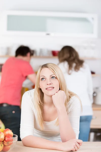 Thoughtful young woman in the kitchen — Stock Photo, Image
