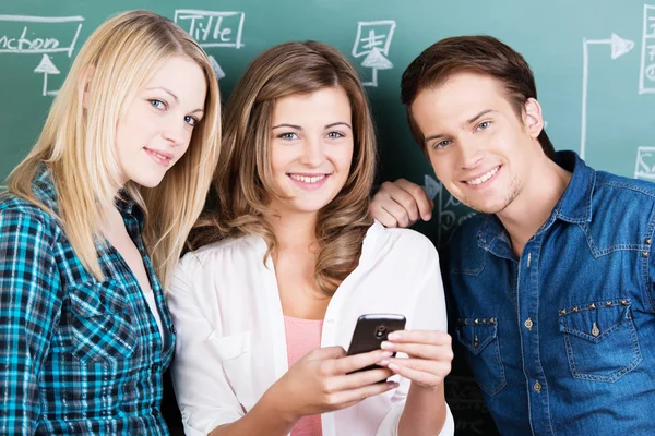 Three teenage students during a break in classes — Stock Photo, Image