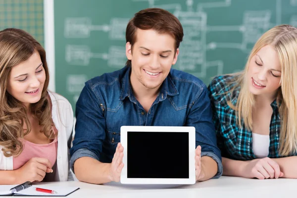 Young students displaying a blank tablet-pc — Stock Photo, Image