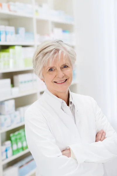 Happy confident mature female pharmacist — Stock Photo, Image