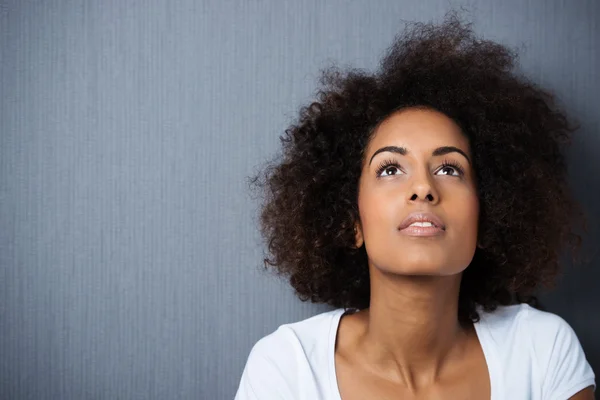 Serious wistful young woman with an afro — Stock Photo, Image