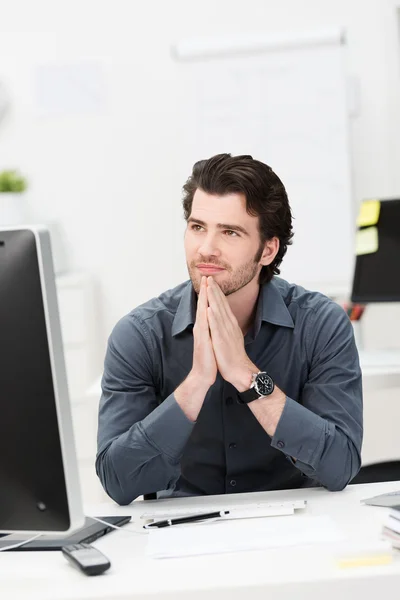 Young businessman thinking of a solution — Stock Photo, Image