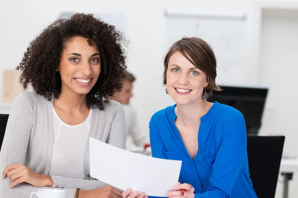 Two friendly businesswoman at the office — Stock Photo, Image