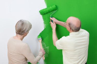 Senior couple renewing the interior decor clipart