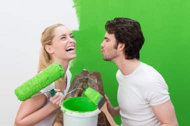 Woman with a paint roller with husband clipart