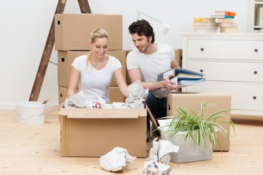 Young couple unpacking clipart