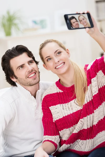 Happy stylish couple taking a self portrait — Stock Photo, Image