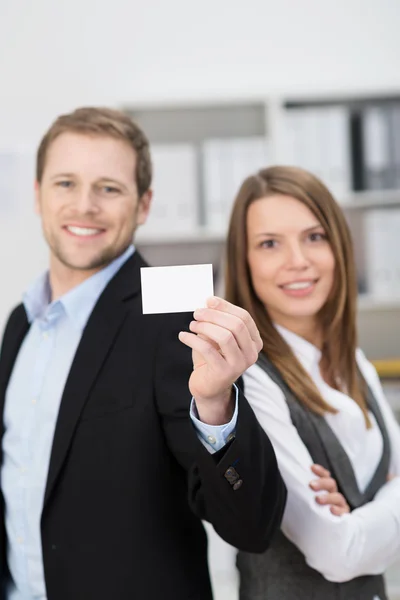 Business partners presenting their business card — Stock Photo, Image